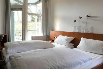 Ein Bett oder Betten in einem Zimmer der Unterkunft Wald & Golfhotel Lottental