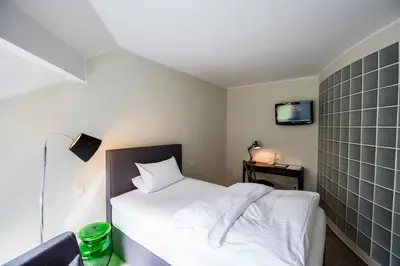 Ein Bett oder Betten in einem Zimmer der Unterkunft Wald & Golfhotel Lottental