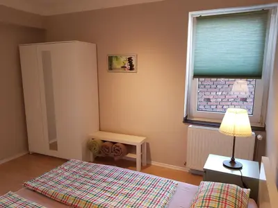 Ein Bett oder Betten in einem Zimmer der Unterkunft Haus Homann-Schneider, Wohnung Wetter