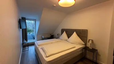 Ein Bett oder Betten in einem Zimmer der Unterkunft Hotel Unterfeldhaus