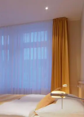 Ein Bett oder Betten in einem Zimmer der Unterkunft Gästehaus Rohleder