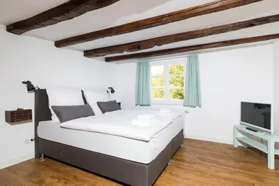 Ein Bett oder Betten in einem Zimmer der Unterkunft Zur Burgstiege