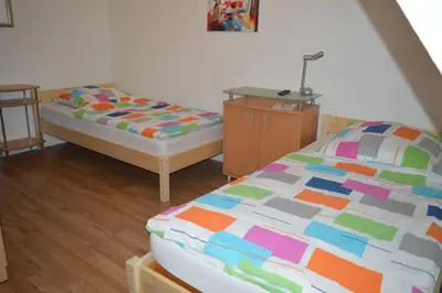 Ein Bett oder Betten in einem Zimmer der Unterkunft Ferienwohnung 