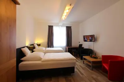 Ein Bett oder Betten in einem Zimmer der Unterkunft Hotel Jammerkrug