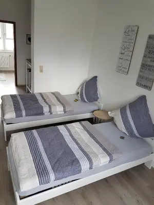 Ein Bett oder Betten in einem Zimmer der Unterkunft Ferienwohnung Veit