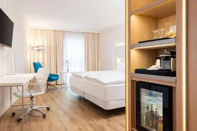 Ein Bett oder Betten in einem Zimmer der Unterkunft NH Essen