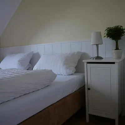 Ein Bett oder Betten in einem Zimmer der Unterkunft Apartmenthaus Sonnen