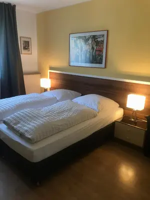 Ein Bett oder Betten in einem Zimmer der Unterkunft Apartmenthaus Sonnen