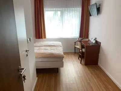 Ein Bett oder Betten in einem Zimmer der Unterkunft Hotel Restaurant zur Post