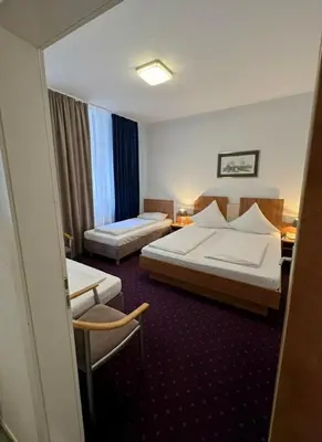 Ein Bett oder Betten in einem Zimmer der Unterkunft Centro Hotel Oberhausen