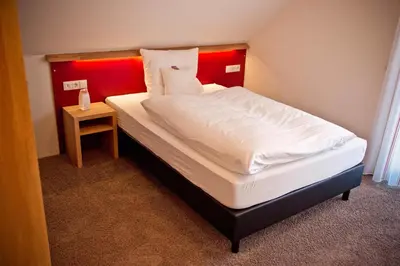 Ein Bett oder Betten in einem Zimmer der Unterkunft Hotel Brauhaus Stephanus