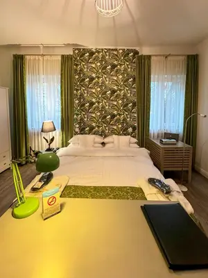 Ein Bett oder Betten in einem Zimmer der Unterkunft Trip Inn Boutique Rubens