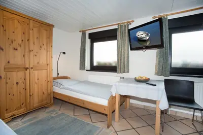Ein Bett oder Betten in einem Zimmer der Unterkunft Pension Löw