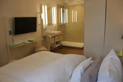 Ein Bett oder Betten in einem Zimmer der Unterkunft Stüttgens Hotel