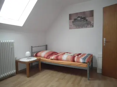 Ein Bett oder Betten in einem Zimmer der Unterkunft Ferienwohnung 