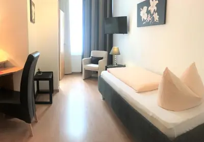 Ein Bett oder Betten in einem Zimmer der Unterkunft Hotel Antoni