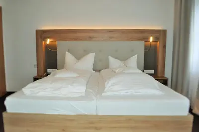 Ein Bett oder Betten in einem Zimmer der Unterkunft Hotel Restaurant Große Teichsmühle