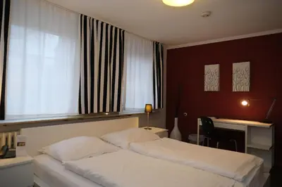 Ein Bett oder Betten in einem Zimmer der Unterkunft Hotel-Restaurant Zur Mühle