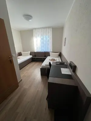 Ein Bett oder Betten in einem Zimmer der Unterkunft Hotel Stockumer Hof