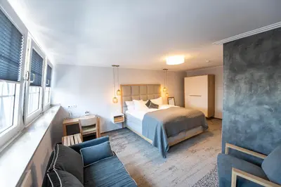 Ein Bett oder Betten in einem Zimmer der Unterkunft Ratshotel