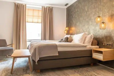 Ein Bett oder Betten in einem Zimmer der Unterkunft Ratshotel