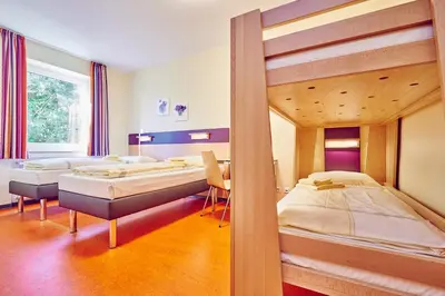 Ein Bett oder Betten in einem Zimmer der Unterkunft DJH Jugendherberge Hagen