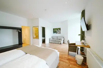 Ein Bett oder Betten in einem Zimmer der Unterkunft Hotel Grüner Baum