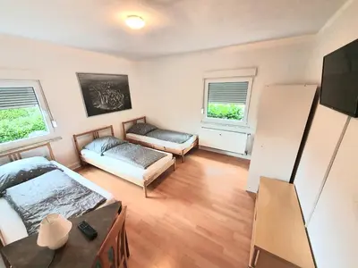 Ein Bett oder Betten in einem Zimmer der Unterkunft Lieblingsmensch Oberhausen mit Terrasse