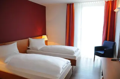 Ein Bett oder Betten in einem Zimmer der Unterkunft Hotel Franz