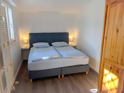 Ein Bett oder Betten in einem Zimmer der Unterkunft Ferienhäuser Seepark Ternsche
