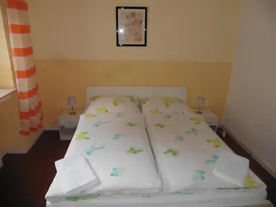 Ein Bett oder Betten in einem Zimmer der Unterkunft Gästehaus Grupello