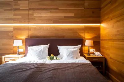 Ein Bett oder Betten in einem Zimmer der Unterkunft Waldhotel Tannenhäuschen