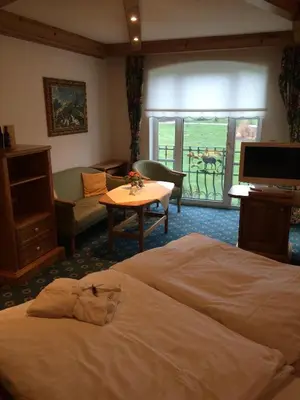 Ein Bett oder Betten in einem Zimmer der Unterkunft Schloss Hotel Holzrichter