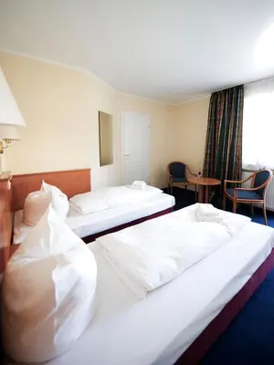 Ein Bett oder Betten in einem Zimmer der Unterkunft Boutique Hotel Villa Stockum