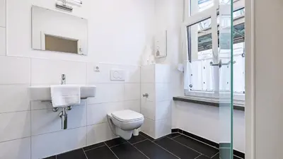 Ein Badezimmer in der Unterkunft Hotel Schwaferts
