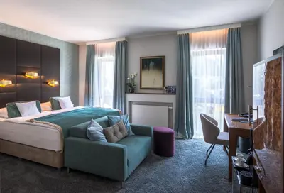 Ein Sitzbereich in der Unterkunft Park Villa Hotel