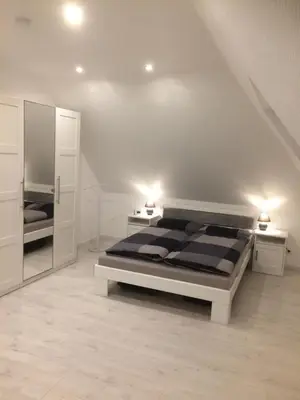 Ein Bett oder Betten in einem Zimmer der Unterkunft Töfte Bude