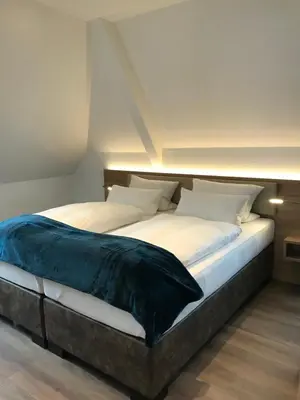 Ein Bett oder Betten in einem Zimmer der Unterkunft Landgasthof-Hotel Zum Steverstrand