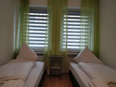 Ein Bett oder Betten in einem Zimmer der Unterkunft Aparthouse Graf-Adolf
