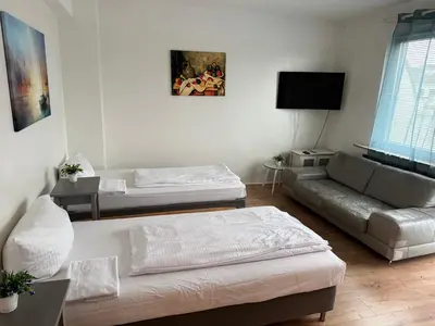 Ein Bett oder Betten in einem Zimmer der Unterkunft Aparthouse Graf-Adolf