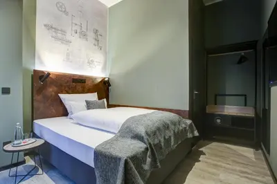 Ein Bett oder Betten in einem Zimmer der Unterkunft Boutique Essen City