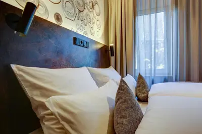 Ein Bett oder Betten in einem Zimmer der Unterkunft Boutique Essen City