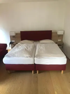 Ein Bett oder Betten in einem Zimmer der Unterkunft Hotel & Gastropark Loemühle