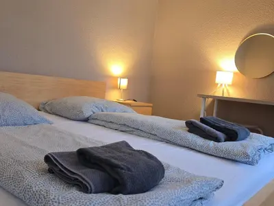 Ein Bett oder Betten in einem Zimmer der Unterkunft Rhein Living Apartment - Balkon und Rheinpromenade