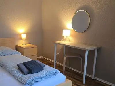 Ein Bett oder Betten in einem Zimmer der Unterkunft Rhein Living Apartment - Balkon und Rheinpromenade