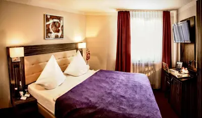 Ein Bett oder Betten in einem Zimmer der Unterkunft Hotel Famosa