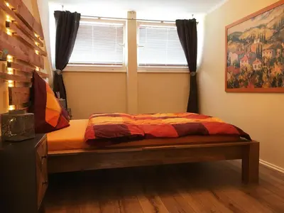 Ein Bett oder Betten in einem Zimmer der Unterkunft Stadthaus Edel - Apartment Binz