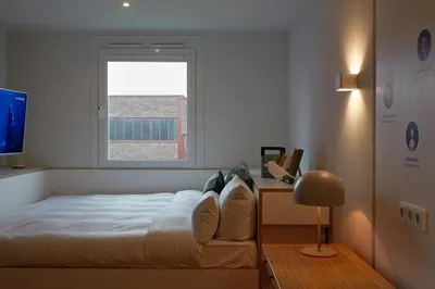 Ein Bett oder Betten in einem Zimmer der Unterkunft hotel friends Essen Zeche Zollverein