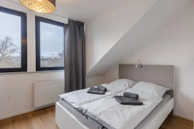 Ein Bett oder Betten in einem Zimmer der Unterkunft Glück Auf Appartements Kammerstr. Duisburg