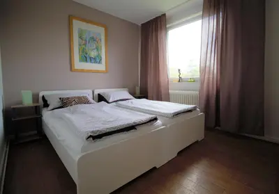 Ein Bett oder Betten in einem Zimmer der Unterkunft Ferienwohnung achtpunkt2